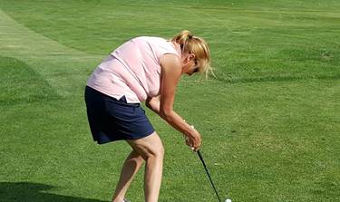 A person playing golf on a green field

AI-generated content may be incorrect.